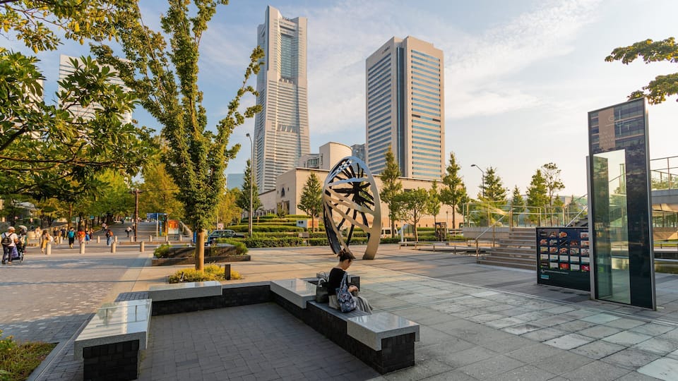 Minato Mirai 21 showing a sunset, outdoor art and a square or plaza