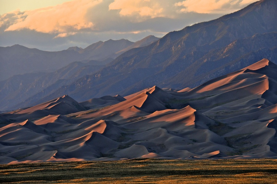 Low angle late afternoon light illuminates dunes and casts shadows, Great Sand Dunes National Park and Preserve, Colorado