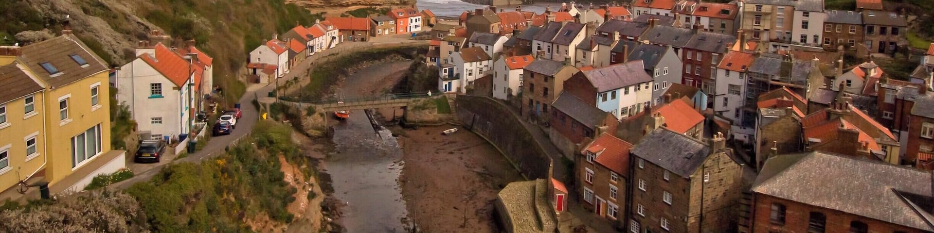 From the viewpoint at the top of the hill looking down onto the village of Staithes North Yorkshire which is just north of Whitby. A very old fishing village you go there you enter year past..