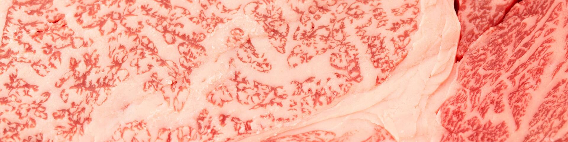 Highly marbled fat texture of Japanese wagyu beef steak in uncooked raw condition.
