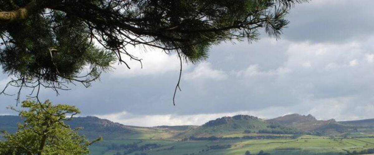 Hen Cloud and the Roaches From the pine crowned minor height of Hillswood at spot height 262 on the Staffordshire Moorlands Walk, there are fine views of Hen Cloud above Tittesworth Reservoir (mid picture)