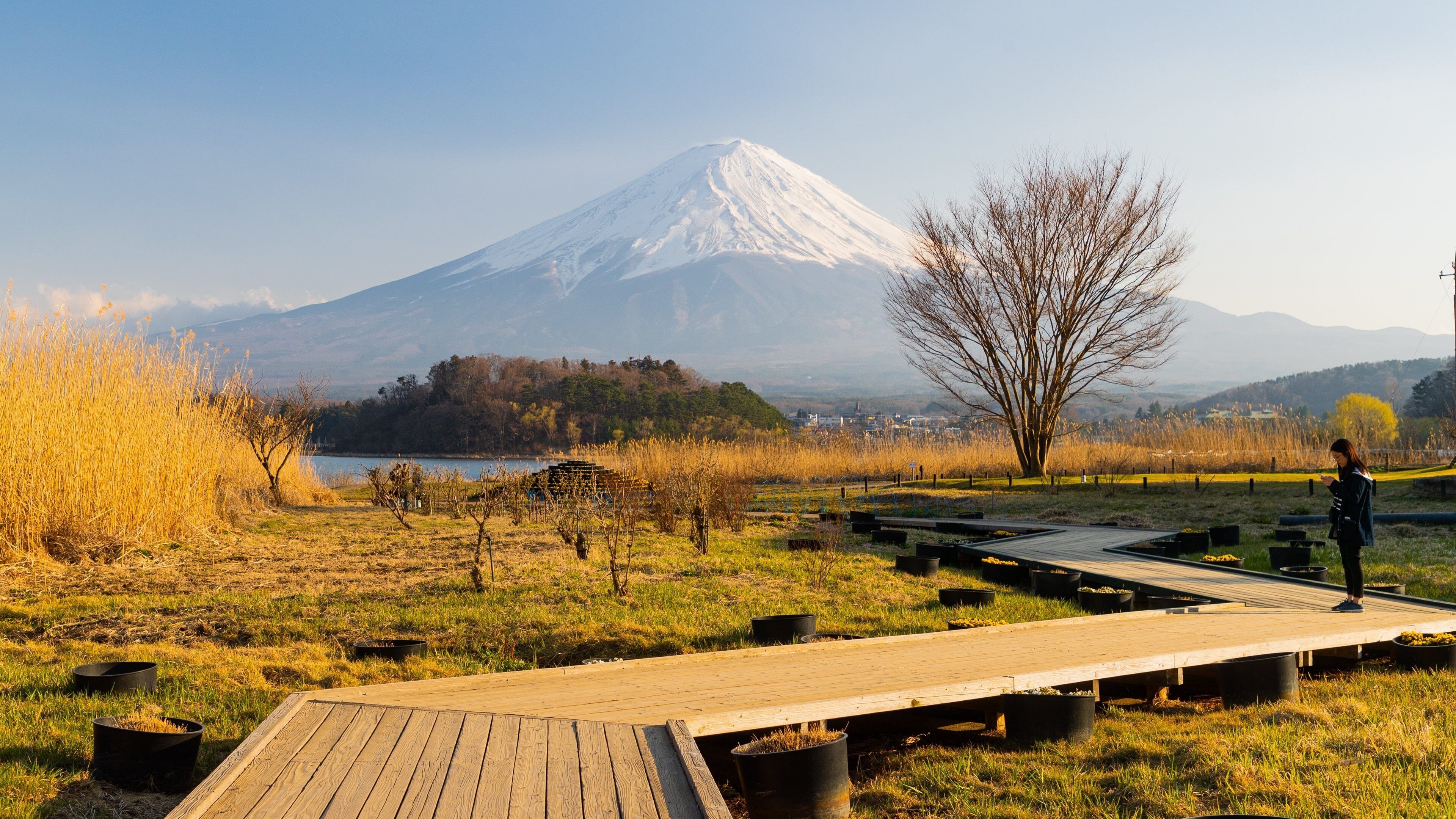 Lake Kawaguchi which includes a bridge, mountains and tranquil scenes