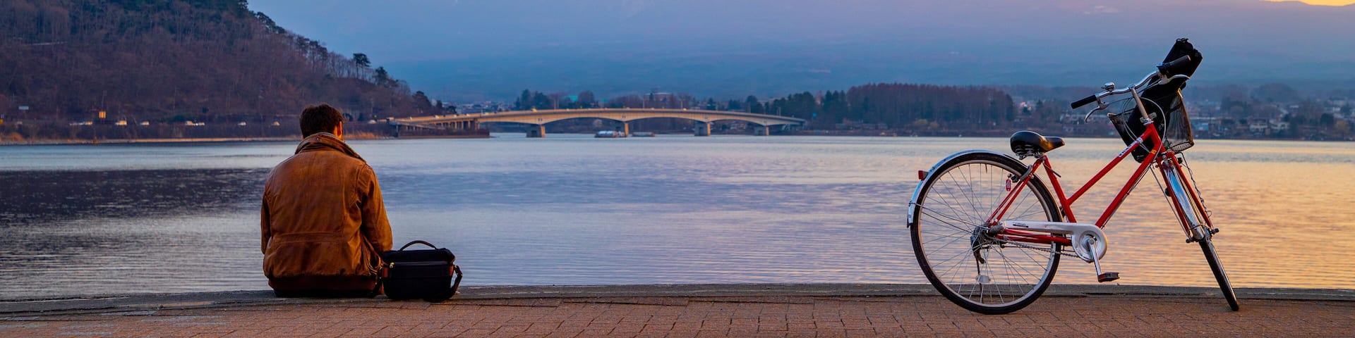 Chubu featuring a lake or waterhole, mountains and a sunset