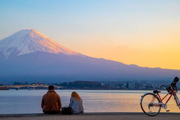 Lake Kawaguchi featuring mountains, a sunset and snow