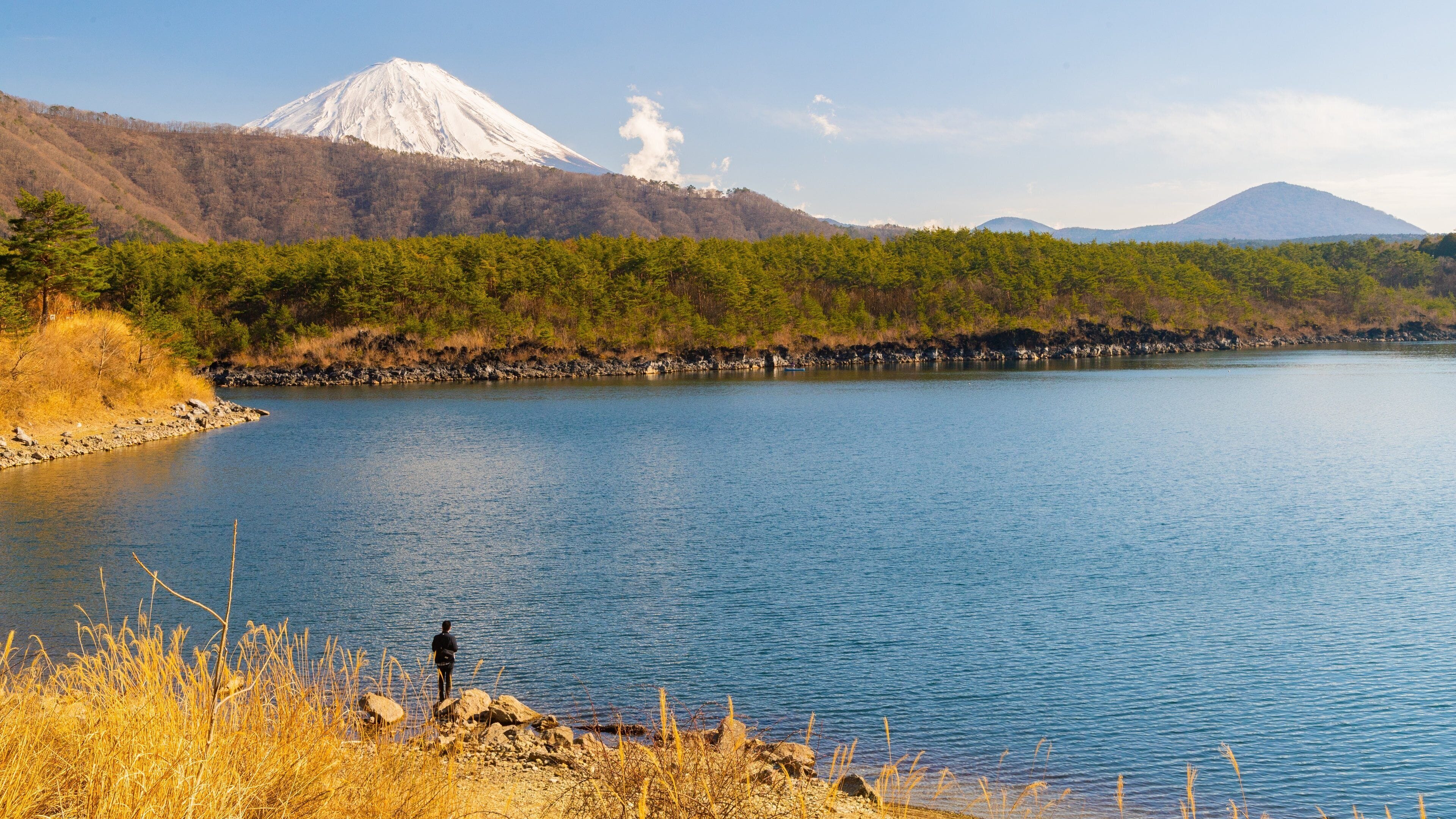 Lake Saiko which includes a lake or waterhole and mountains