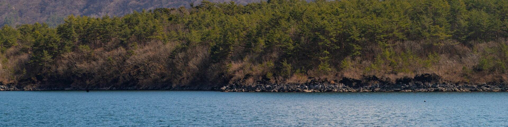 Lake Saiko featuring snow, a lake or waterhole and mountains