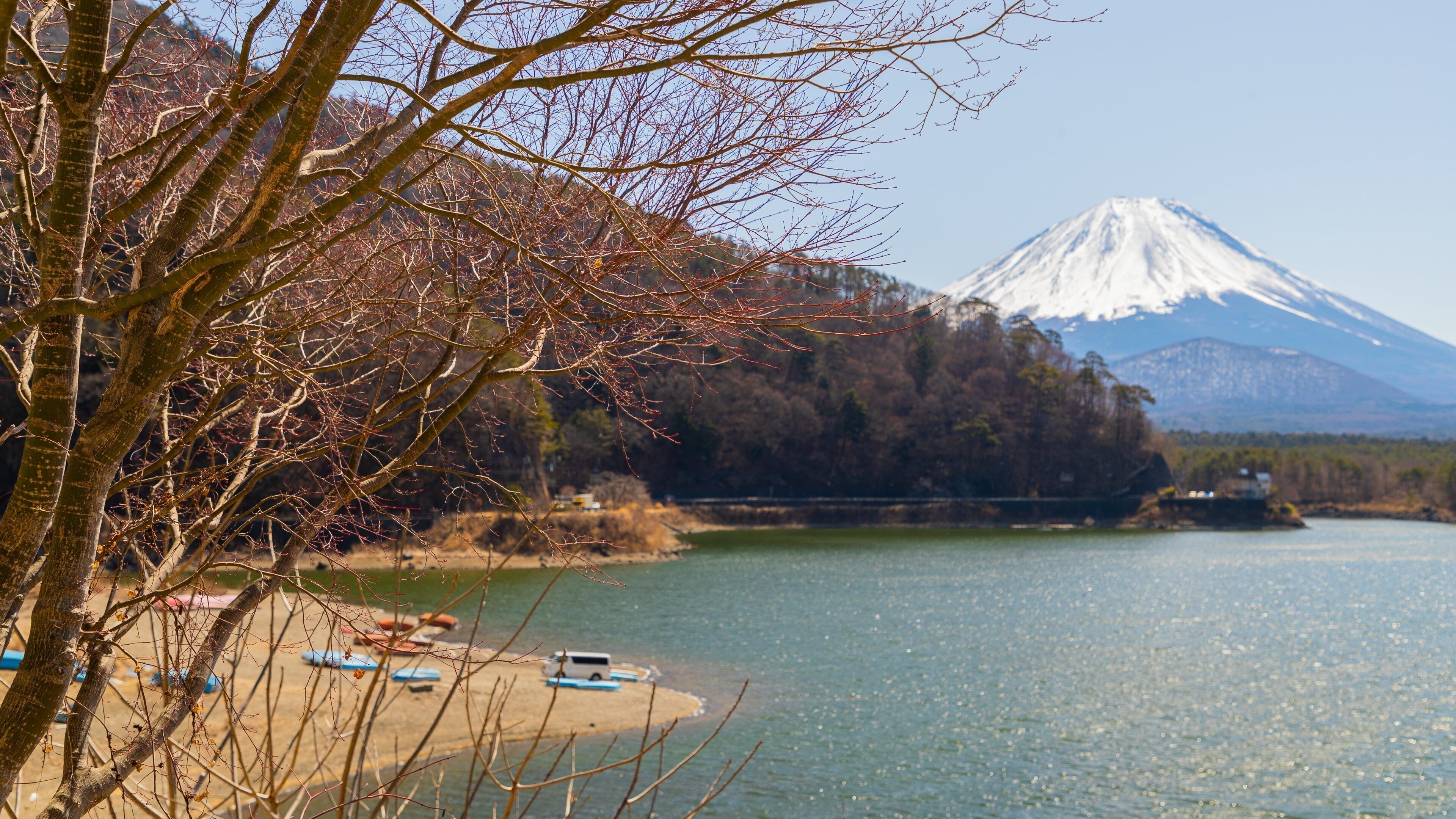 Lake Shojiko which includes mountains and a lake or waterhole