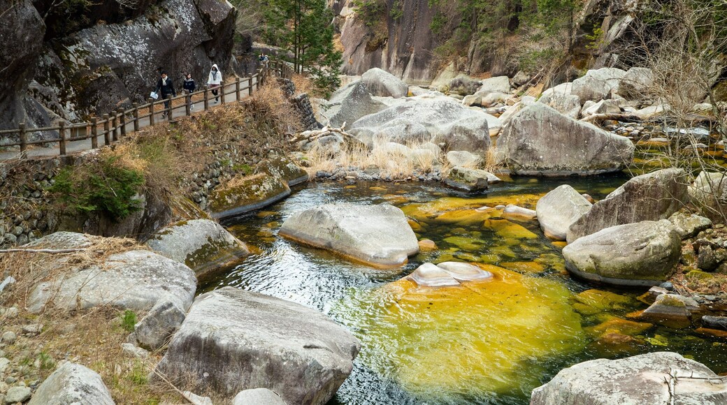 Shosenkyo which includes a pond and tranquil scenes as well as a small group of people