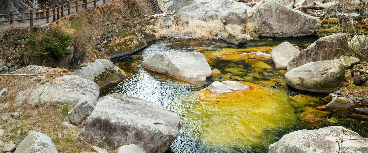 Shosenkyo which includes a pond and tranquil scenes as well as a small group of people