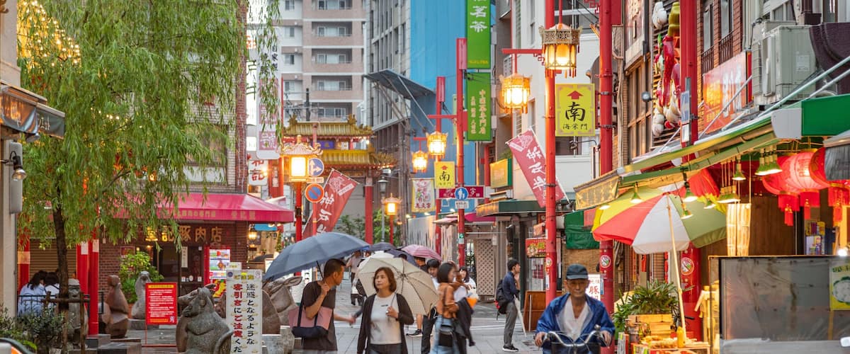 Motomachi Shopping Street showing a city and street scenes as well as a couple
