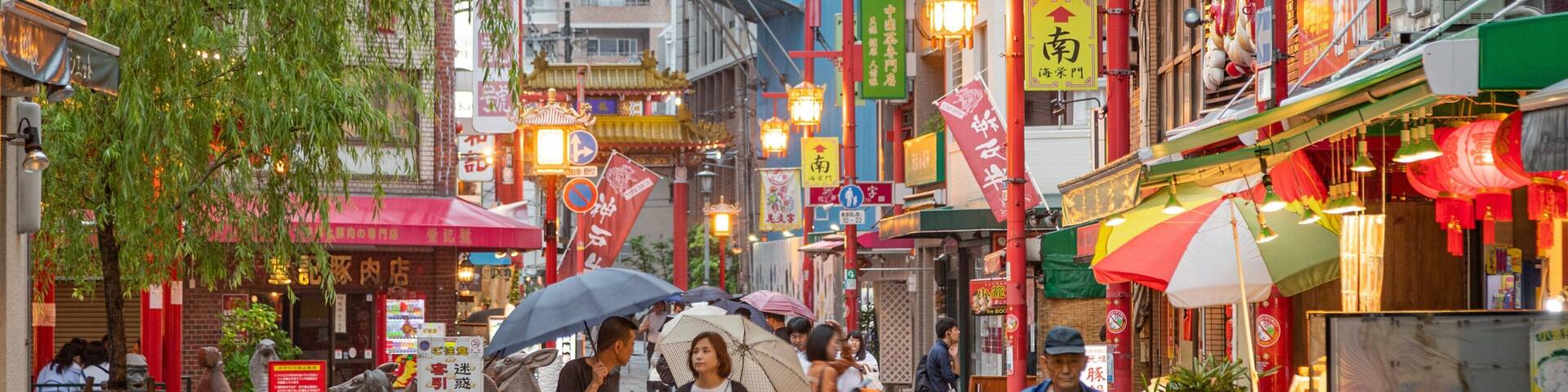 Motomachi Shopping Street showing a city and street scenes as well as a couple