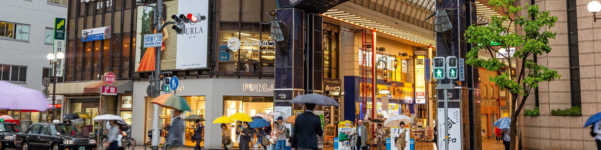 Motomachi Shopping Street which includes street scenes, a city and signage