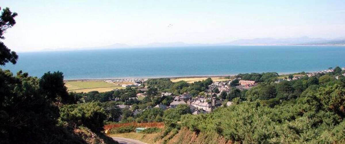 Lane down to Llwyngwril, near to Llwyngwril, Gwynedd, Wales. In the distance are the hills of the Lleyn Peninsula.
