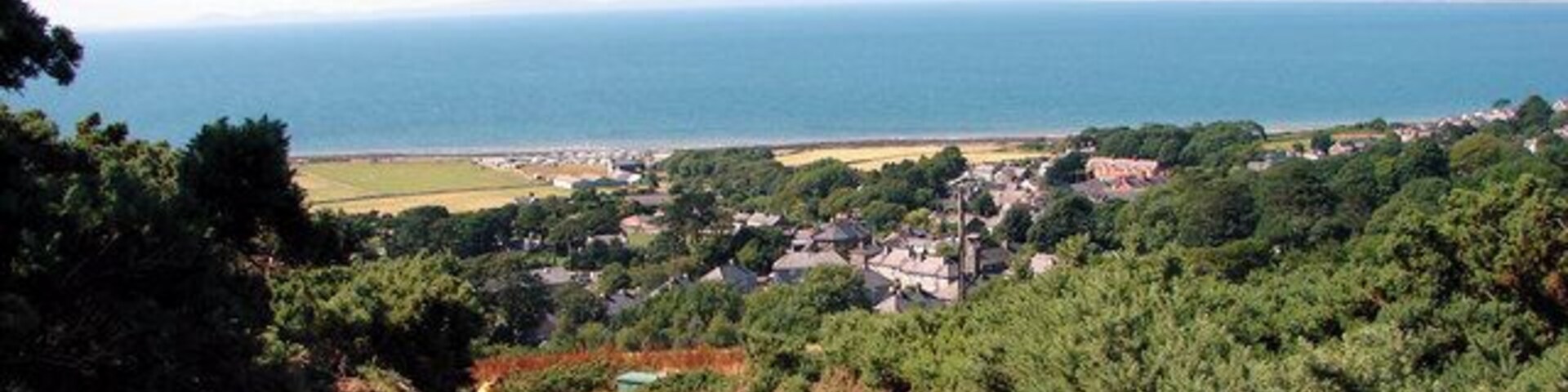 Lane down to Llwyngwril, near to Llwyngwril, Gwynedd, Wales. In the distance are the hills of the Lleyn Peninsula.