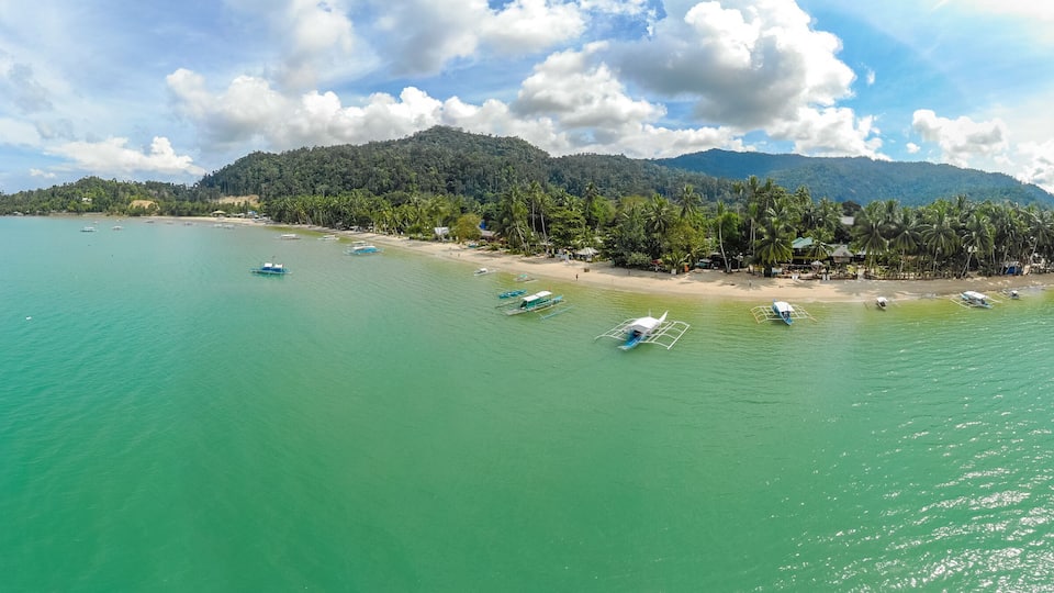 Aerial view of Port Barton Beach on paradise island, tropical travel destination - Port Barton, San Vicente, Palawan, Philippines.