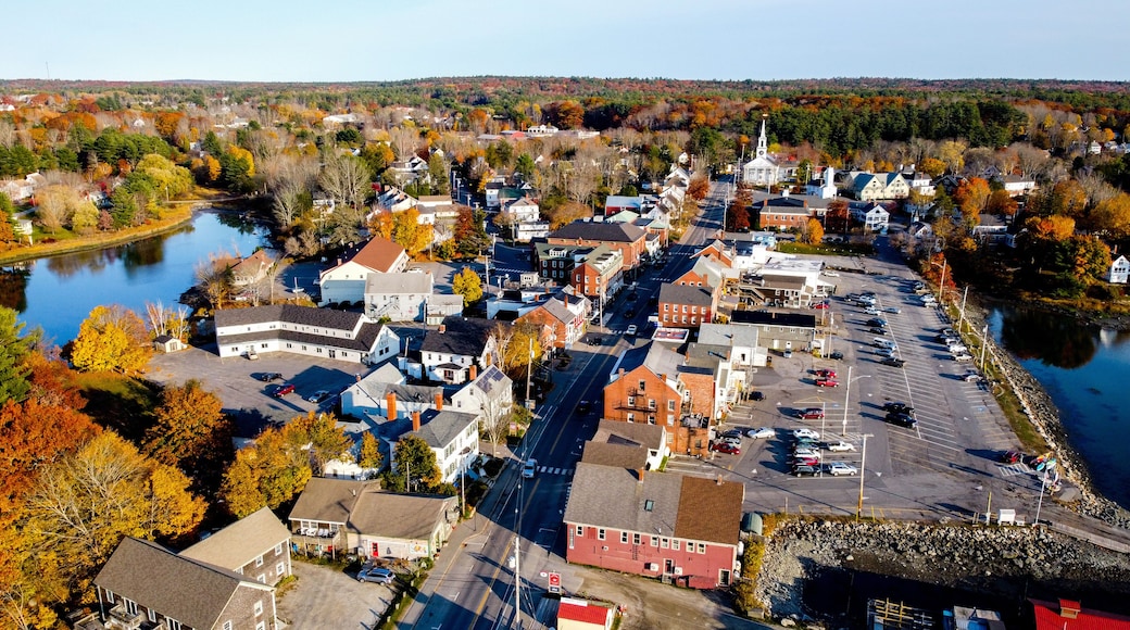 Aerial view of small coastal new england maine town - main street with white church