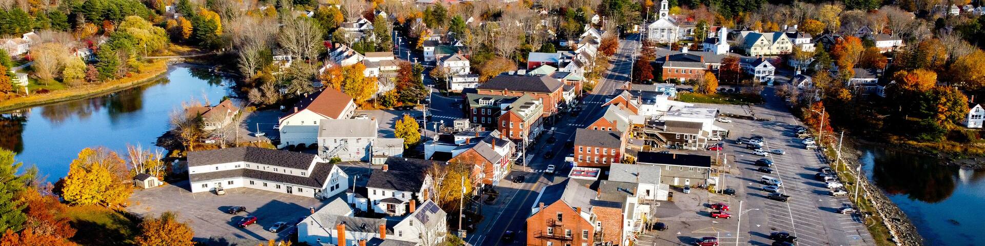 Aerial view of small coastal new england maine town - main street with white church