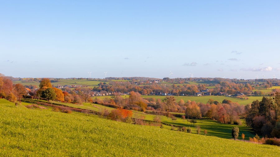 Autumn landscape of hilly countryside in Zuid-Limburg, Small houses on hillside with sunlight in the morning, Gulpen-Wittem is a villages in southern part of the Dutch province of Limburg, Netherlands