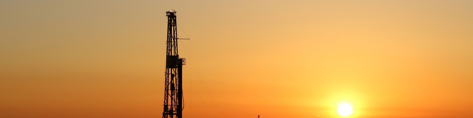 Sunset going over a drilling rig in the Permian Basin of West Texas