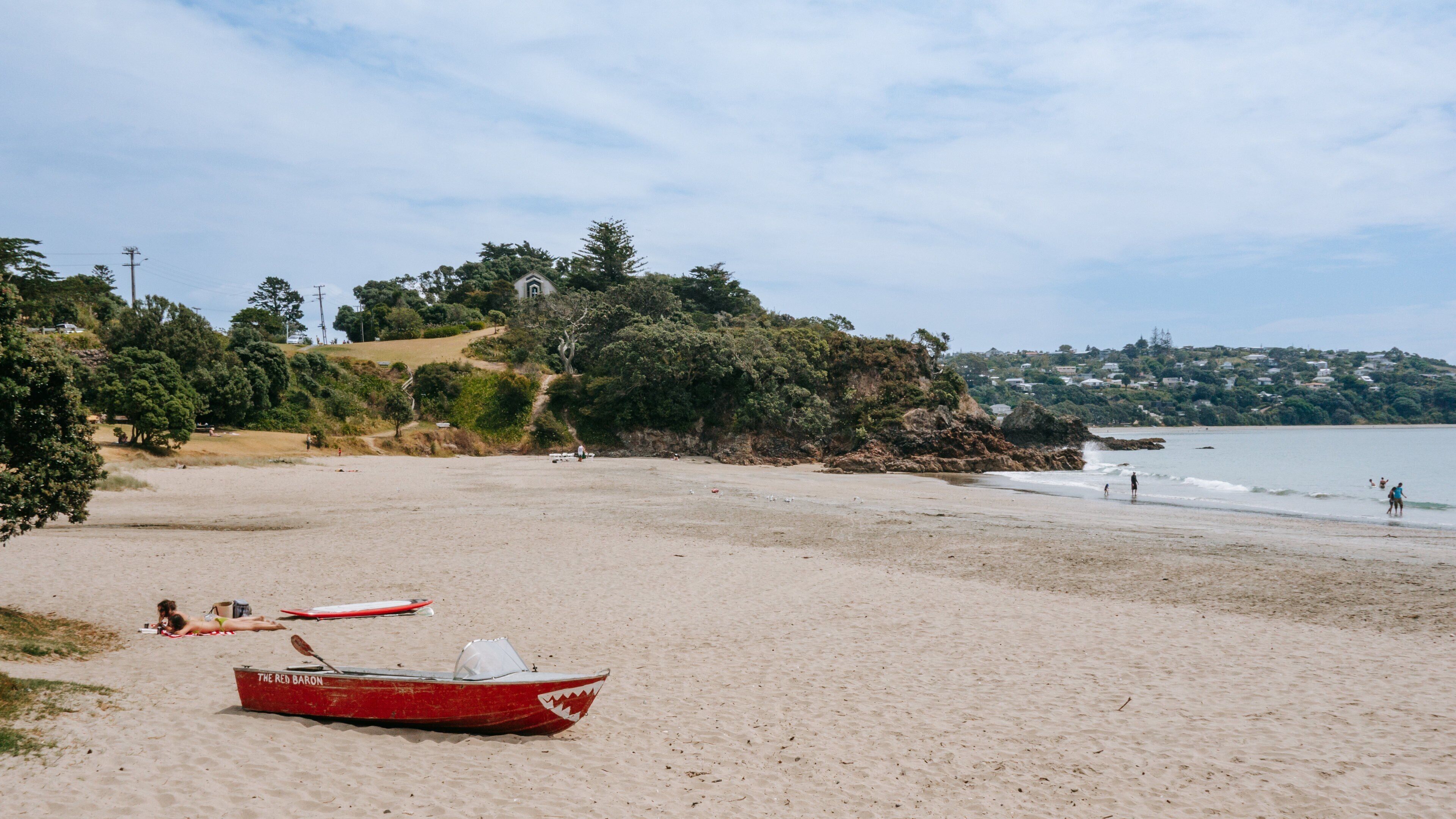 Waiheke Island which includes a beach and general coastal views