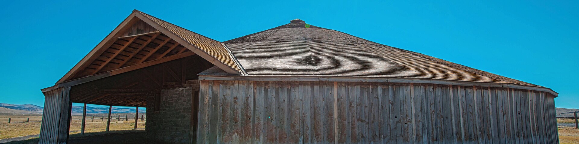 The Pete French Round Barn stands in the heart of Harney County and remains a monument to one man’s livestock empire. Peter French arrived in 1872 and began amassing land and cattle. By the mid-1880s, his enterprise had grown to 70,000 acres and 45,000 head of cattle.
Some claimed he didn’t legally acquire the land or water rights, which prompted land disputes and court cases and added to his controversial reputation. One of the disputes eventually led to his murder in 1897.
Although dubbed the ‘Cattle King,” French was the first rancher in the area to put up hay. He also raised thousands of sheep for their wool. The Round Barn was used to train wild horses to pull long wagon trains full of wool, hay and supplies to market in Oregon City.
In today’s landscape, this type of barn is unique. But during 1880–1920, round barns became popular in the Midwest where they were promoted as being efficient for progressive methods of farming.
The Round Barn is near the Malheur National Wildlife Refuge, a network of wetlands that attract diverse bird and wildlife species. As you drive through the area, take in the sweeping views of the high buttes surrounding the low plains and marshes and the picturesque Steens Mountain towering in the distance.
#Oregon #PeteFrench #roundbarn #extremeOregon