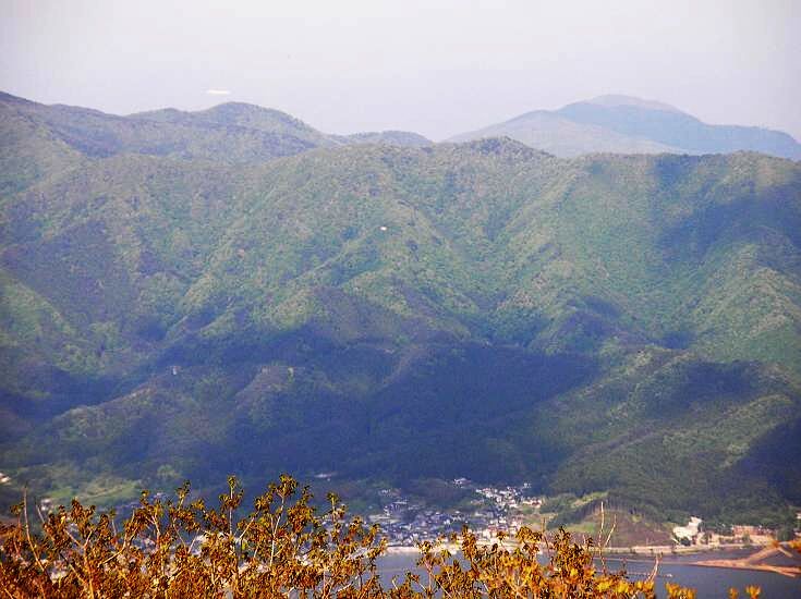 A mountainous landscape with a town nestled in the valley.