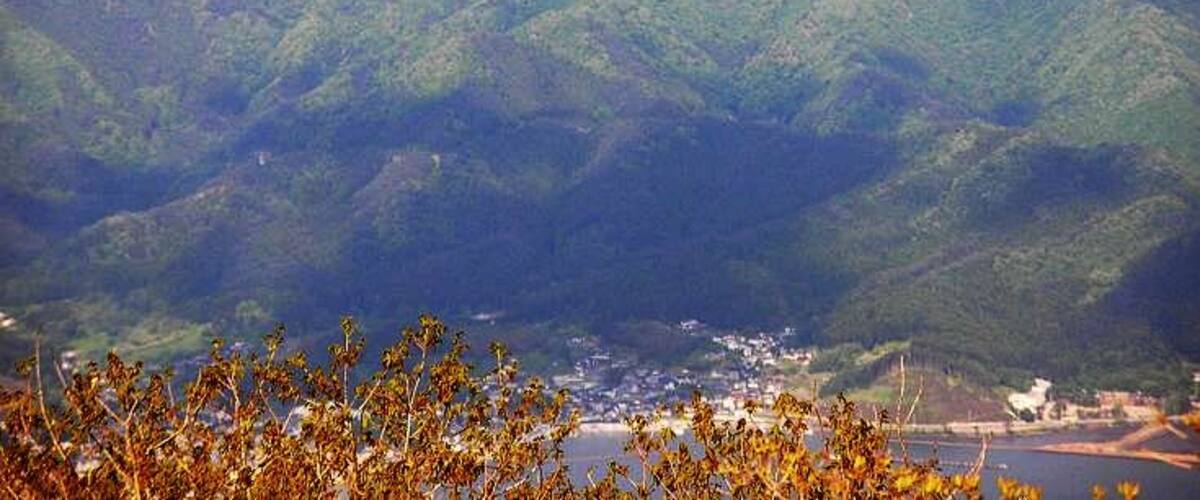 A mountainous landscape with a town nestled in the valley.