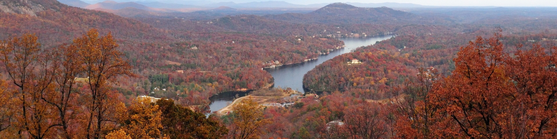 View To Red Colored Trees At Lake Lure And Broad River During Indian Summer From Chimney Rock North Carolina On A Cloudy Autumn Day