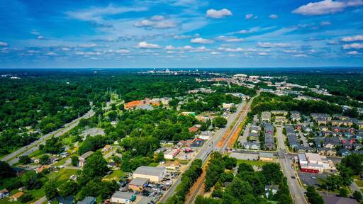 Aerial shot of Greensboro in North Carolina on the horizon from the West