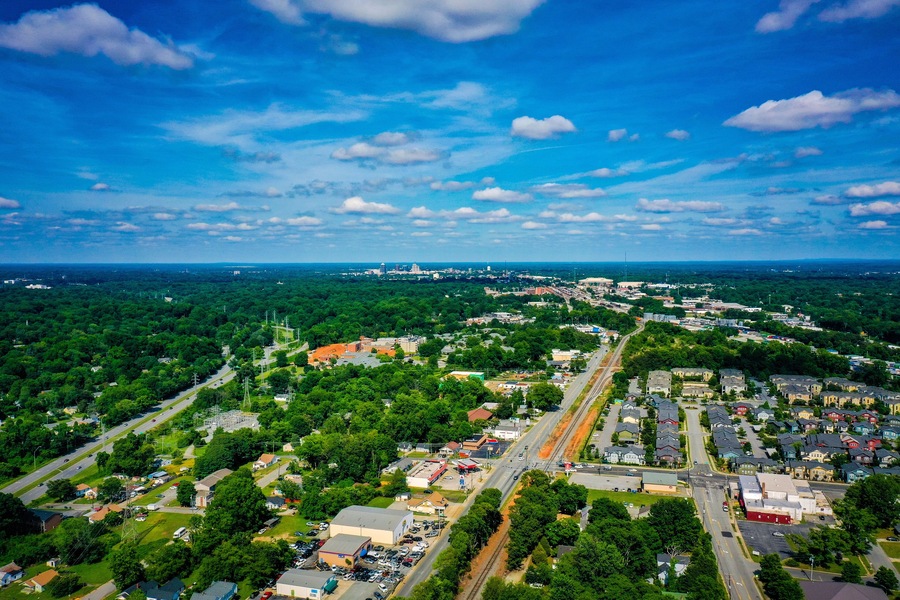 Aerial shot of Greensboro in North Carolina on the horizon from the West