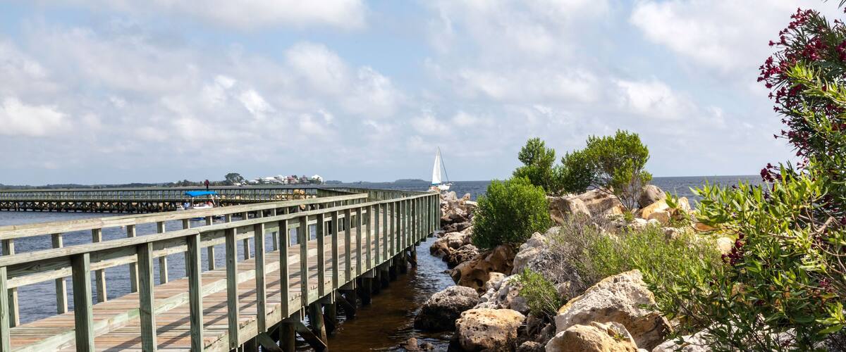 D9JK1Y Fishing pier and rock jetty at Keaton Beach on the Gulf of Mexico.