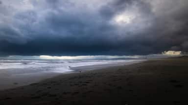Long exposure shot of dark stormy clouds over the sea in Enoshima, Kanagawa Prefecture, Japan