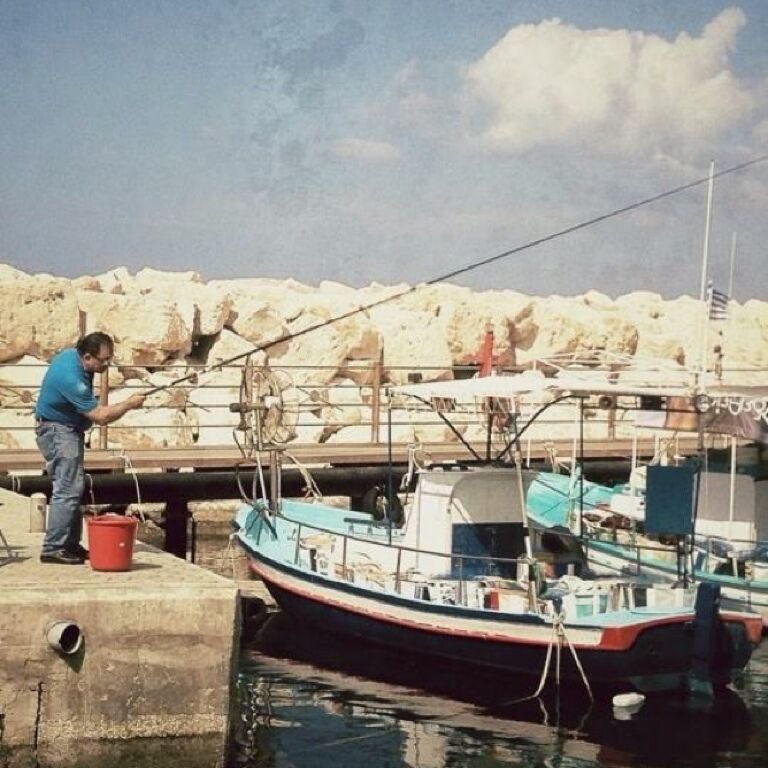 A local chap fishing at Pomos Harbour, nr Polis, Cyprus 