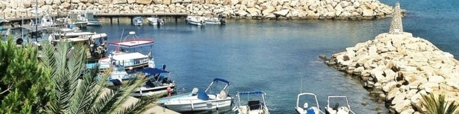 Pomos harbour, Pomos, Cyprus. Beautiful little fishing harbour located aporox 19 kms from Polis along the coast road. There is a small beach located near the harbour. It's a little difficult under foot as mostly pebble and stone but worth it for the views