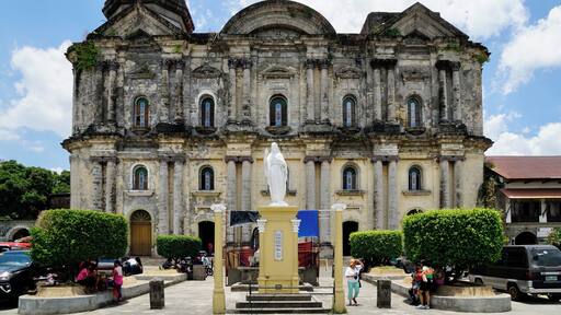 The facade of the Taal Basilica, the Minor Basilica of St Martin of Tours (the Patron Saint of Taal), Taal City, Batangas, Philippines (Apr 2018): though originally founded in the 1570s by the Augustinians, the church has been re-built or restored several times following eruptions of the Taal Volcano and earthquakes.
