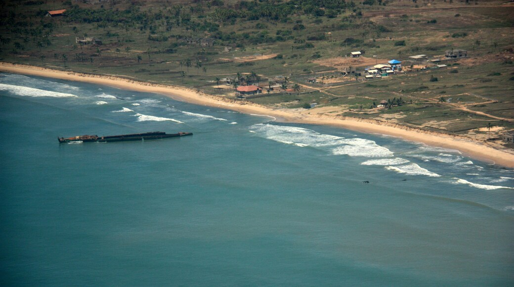 Aerial view of a disassembled ship wreckage off the coast of Ghana