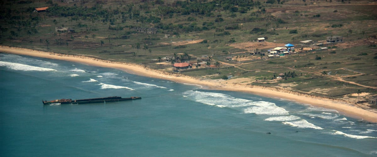 Aerial view of a disassembled ship wreckage off the coast of Ghana