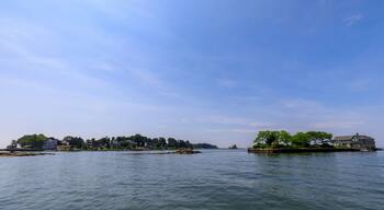 Waterfront homes on small islands under a clear blue sky