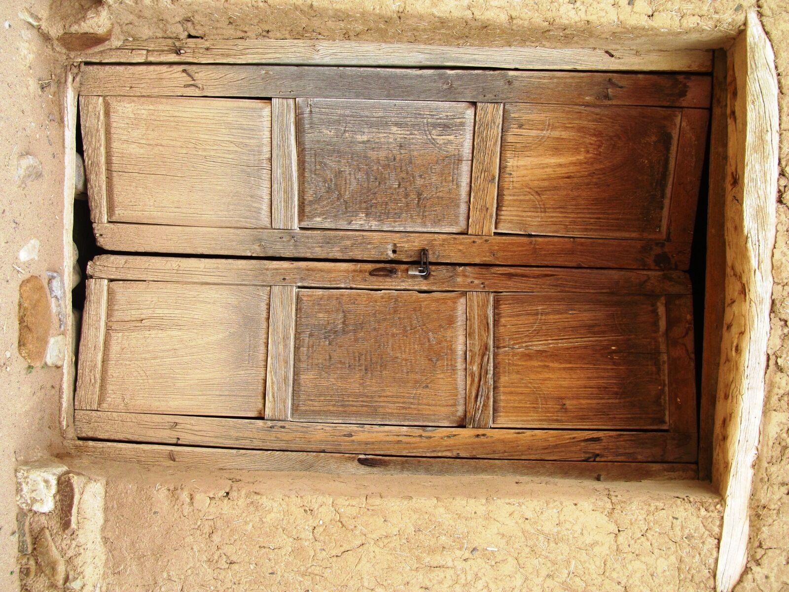 Quite old door in an adobe house. 