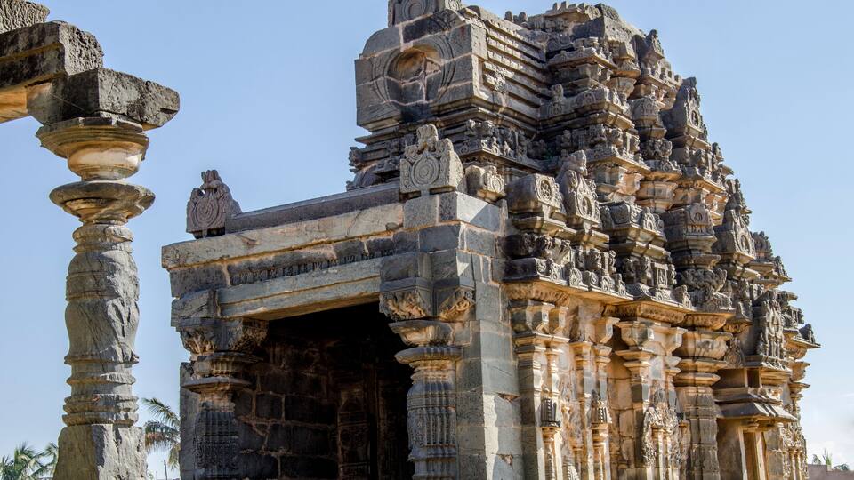 An ancient temple with intricate carvings and a large doorway.