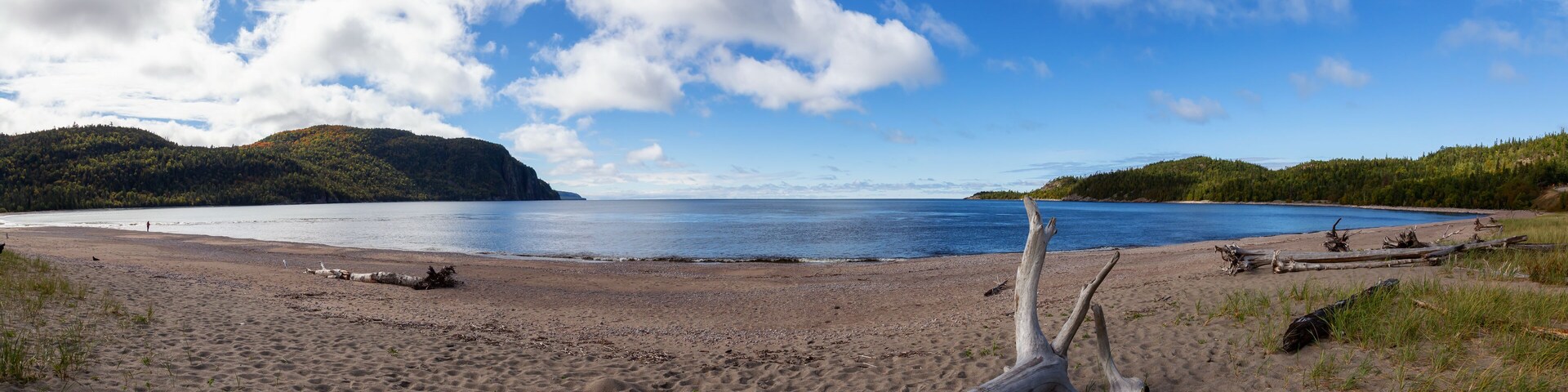 Beautiful view of a sandy beach during a sunny day. Taken in Old Woman Bay, Lake Superior Provincial Park, Ontario, Canada.