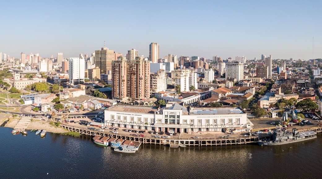 Panoramic view of skyscrapers skyline of Latin American capital of Asuncion city, Paraguay. Embankment of Paraguay river. Birds eye aerial drone photo. Ciudad de Asunción Paraguay.