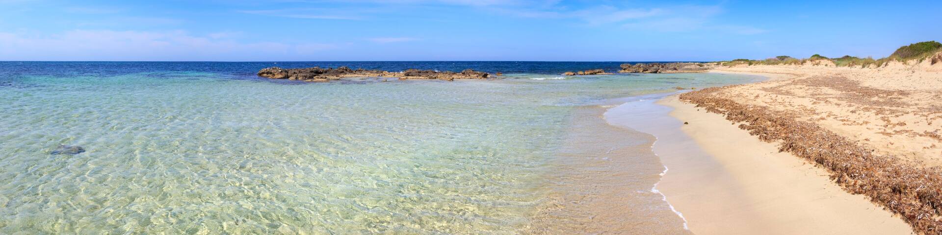 Typical beach of Salento, with almost sandy coves and embellished with low cliffs, easily accessible, in the territory of the municipalities of Salve and Ugento in Puglia, Italy.