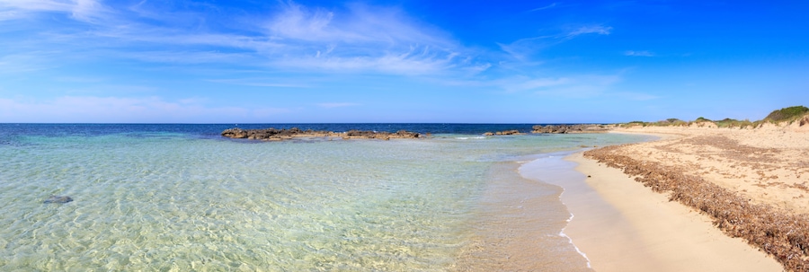 Typical beach of Salento, with almost sandy coves and embellished with low cliffs, easily accessible, in the territory of the municipalities of Salve and Ugento in Puglia, Italy.