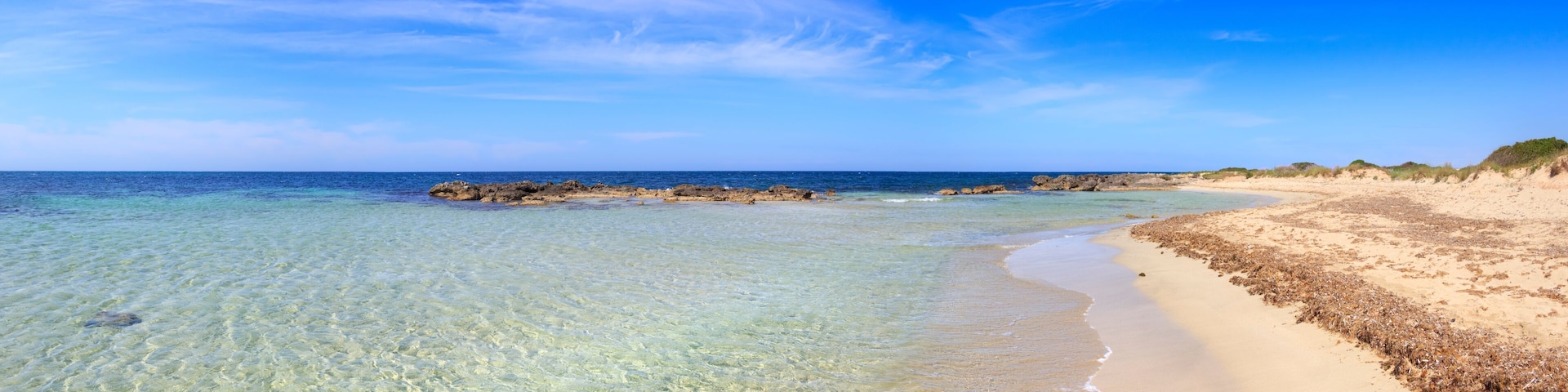 Typical beach of Salento, with almost sandy coves and embellished with low cliffs, easily accessible, in the territory of the municipalities of Salve and Ugento in Puglia, Italy.