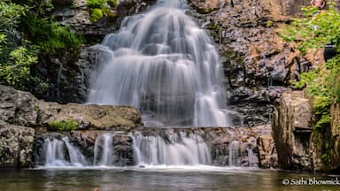 This accessible and beautiful falls trail is a must-do for hikers in the area or passing through. Amble through the trees of Hickory Run State Park and enjoy the view of Hawk Falls.
Hawk Falls is located in Hickory Run State Park, Pennsylvania in the Poconos Mountains. The 0.7 out-and-back trail is mostly downhill, with some slippery sections so wear adequate shoes and take caution when you approach the falls. A rock outcrop at the top of the falls makes for a great lookout point. #hawkfalls #hikingfun #hiking #hikingadventures #hickoryrunstatepark #waterfall #pennsylvania #explorer #goodearth #naturalbeauty #ignature #instadaily #exploremore #waterfalls #waterfallhikes #hikevibes #weekendhiking #travel #traveller #travelgirl #travelblogger #traveltheworld #travelbloggers #traveljournal #igwaterfalls #ig_newtag #usadiaries #hikeandshoot #naturegram #green #TakeAhike #AquaTrove