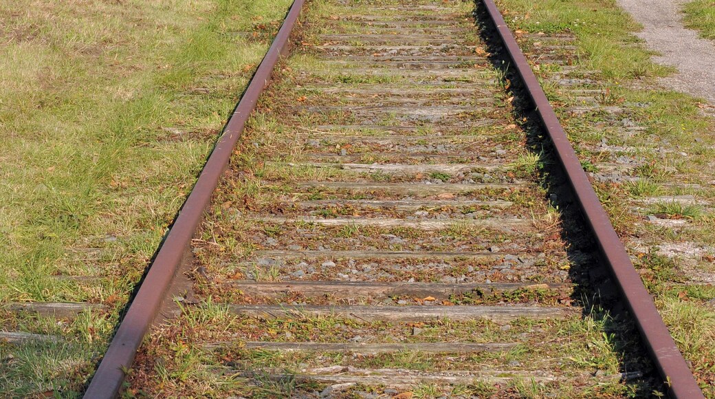 Former railway line #63 Torhout-Kortemark-Ypres (West Flanders, Belgium): a short section maintained as remembrance in Staden. In the background: broken up part transformed into a bikeway.