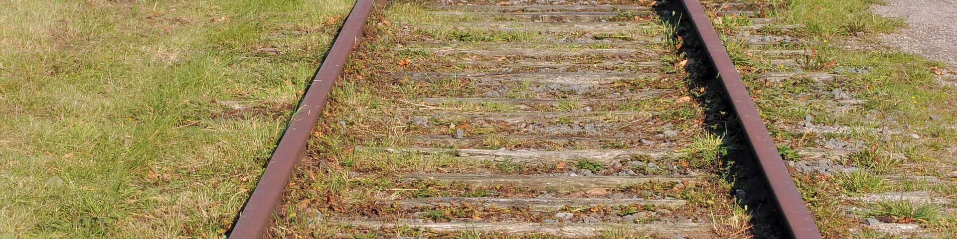 Former railway line #63 Torhout-Kortemark-Ypres (West Flanders, Belgium): a short section maintained as remembrance in Staden. In the background: broken up part transformed into a bikeway.