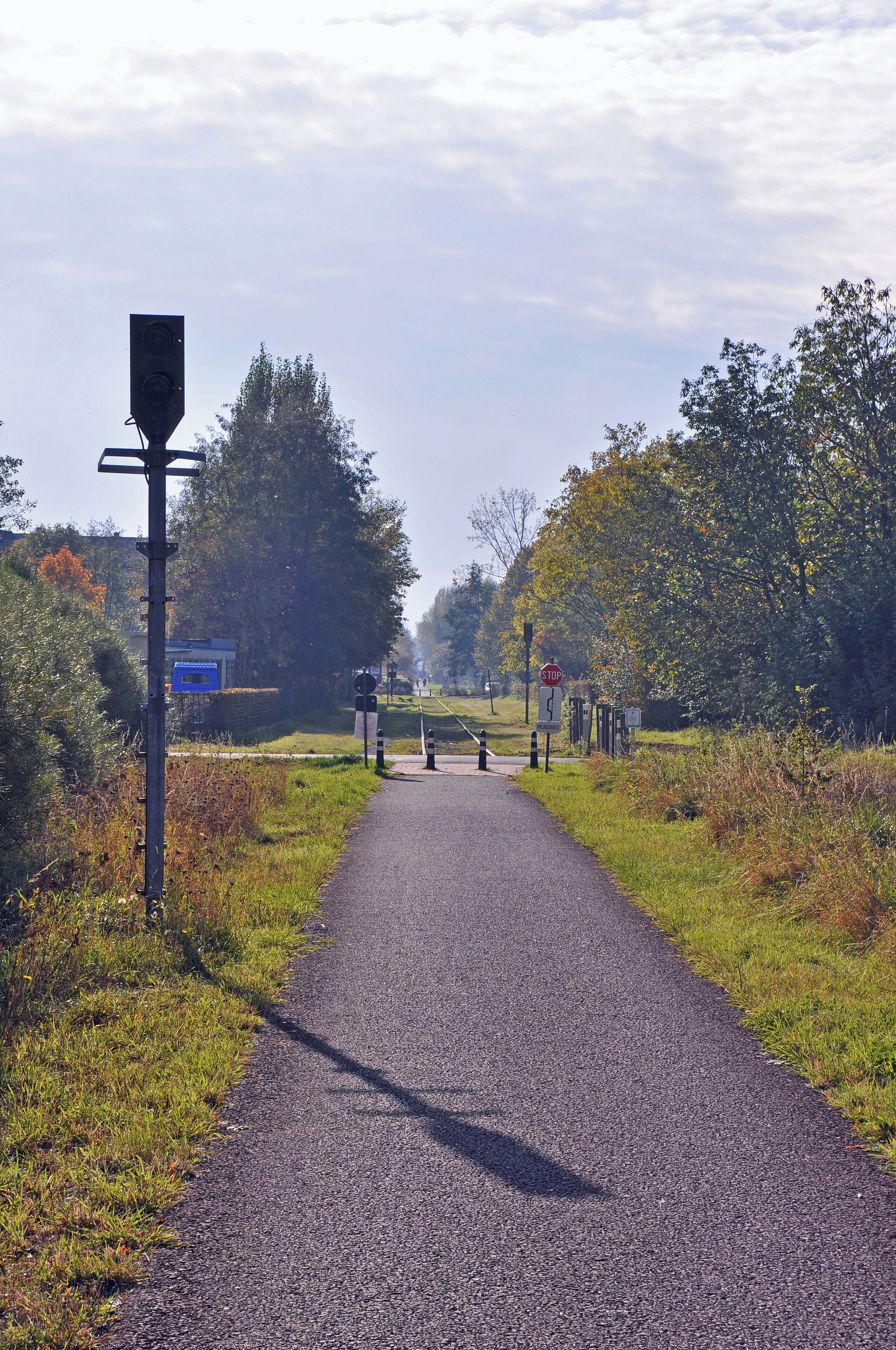 Former railway line #63 Torhout-Kortemark-Ypres (West Flanders, Belgium) in Staden. At the left: an old signal post.