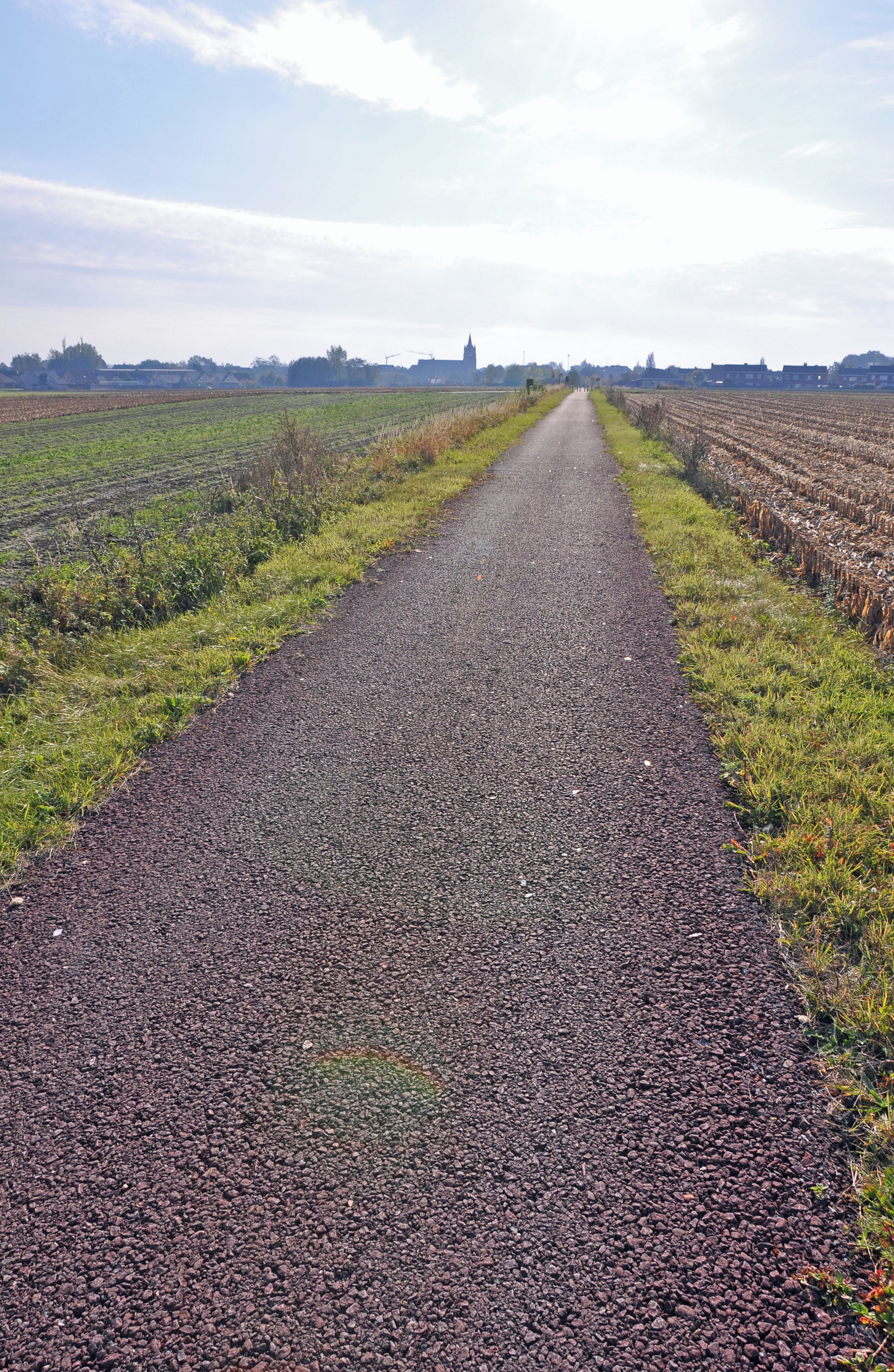 Former railway line #63 Torhout-Kortemark-Ypres (West Flanders, Belgium) between Staden and Kortemark: now broken up and transformed into a bikeway. In the background: the village of Staden.